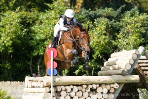 Megan Heath riding ST DANIEL at the Watson Fuel Log Pile in the CCI3* Event at the 2015 Blenheim Palace International Horse Trials